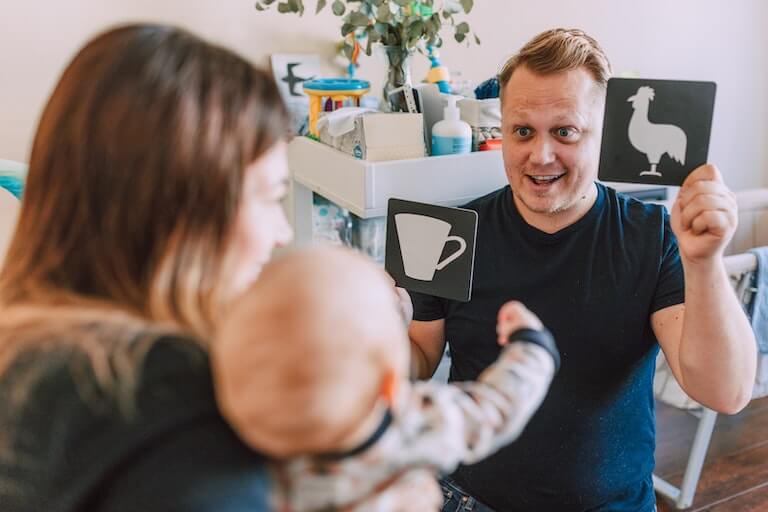 Parents teaching their children words with flashcards