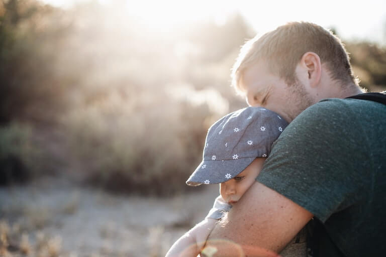 Father holding his daughter