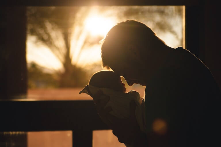 Father holding his newborn baby