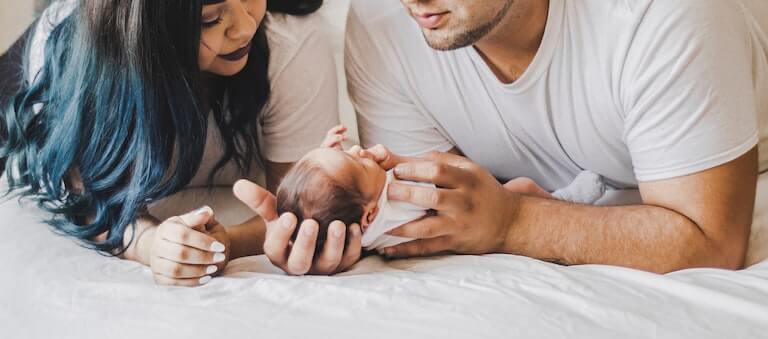 Mom and dad holding their newborn baby