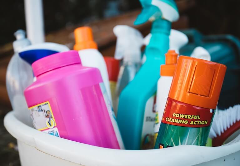 A bucket filled with cleaning supplies