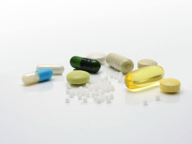Pills and medication laying on a table