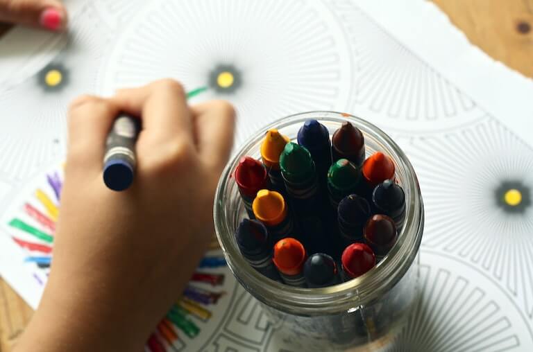 Cup of crayons in kindergarten classroom