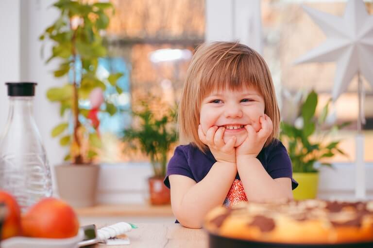 Little girl smiling in kindergarten class
