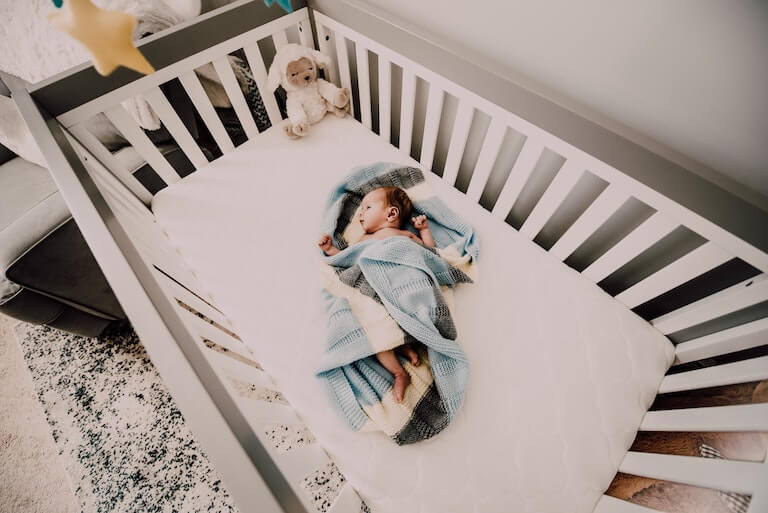 Baby sleeping in a crib