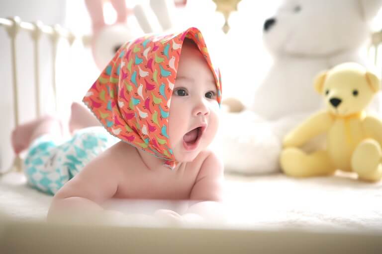 Baby girl with her mouth open