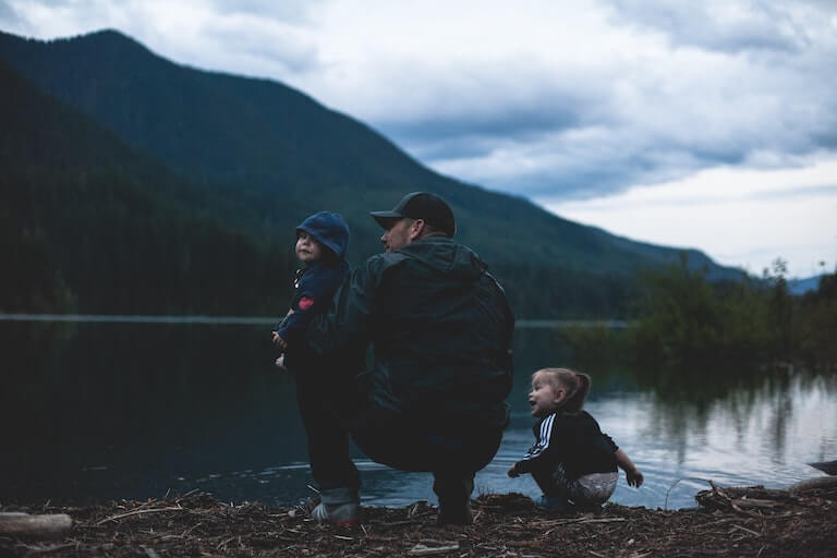 Dad and two kids enjoying a vacation in the mountains