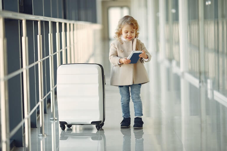 Girl with a suitcase in the airport