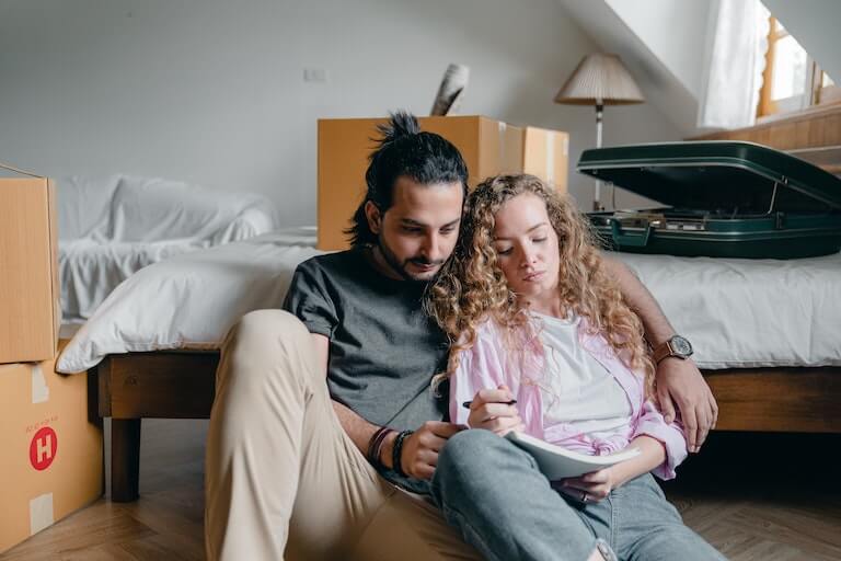 Mother and father making a checklist for travel