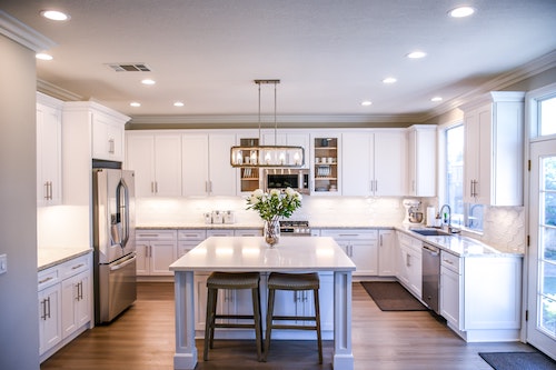 A clean and elegant white kitchen