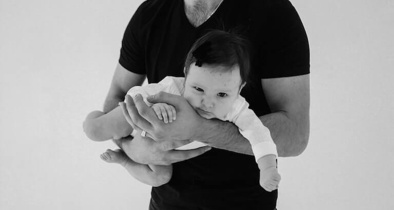 Father holding his daughter