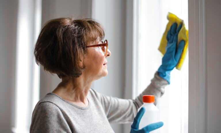 Woman cleaning windows