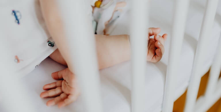 Baby sleeping in a crib