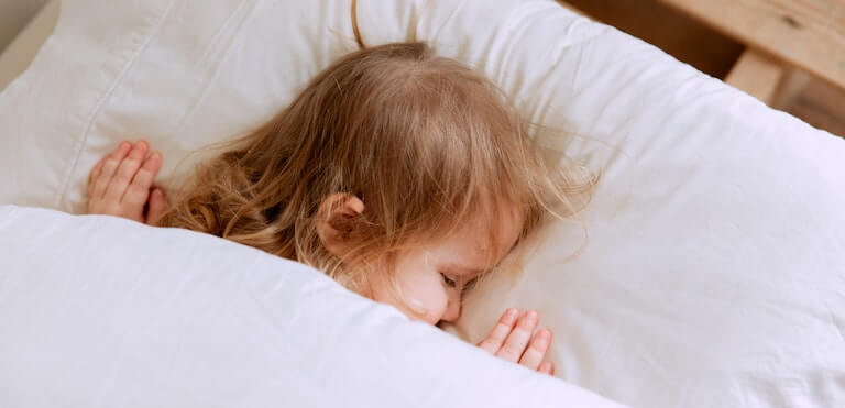 Girl sleeping in a bed
