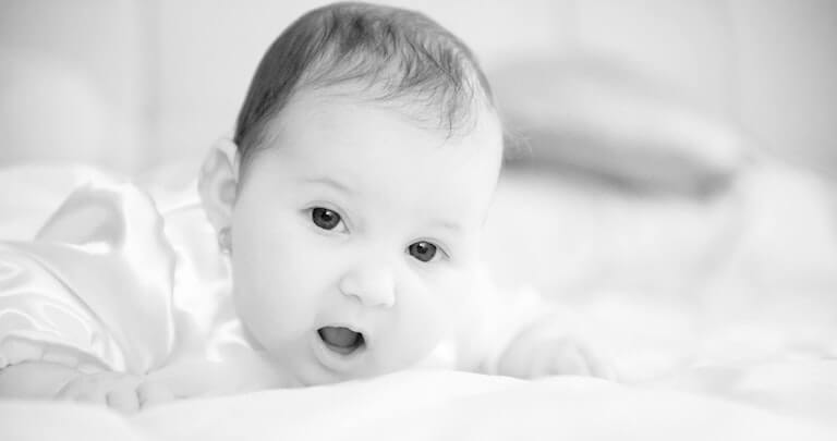 Newborn baby with mouth open