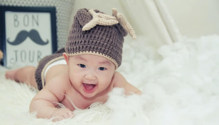 Newborn baby with a hat on